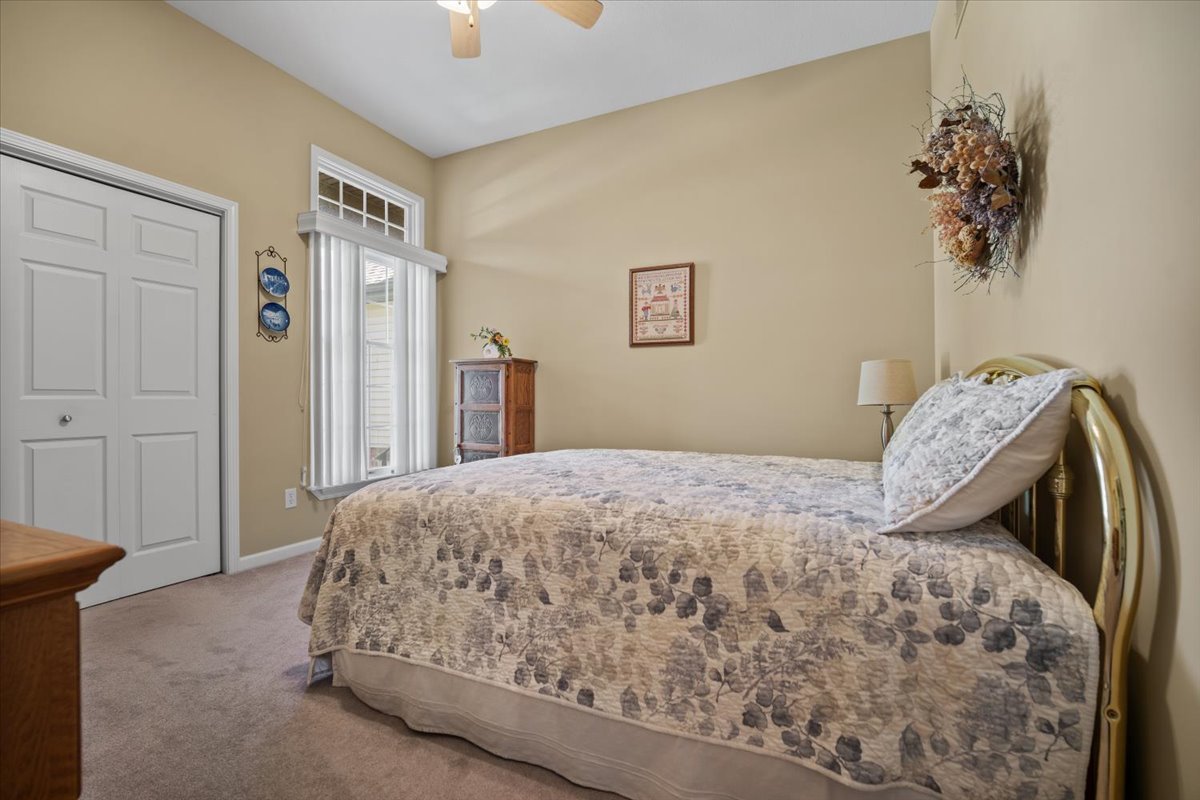 1721 Partridge Point Normal, IL 61761 - Photo 30 of 37 a bedroom with a bed and a painting on the wall