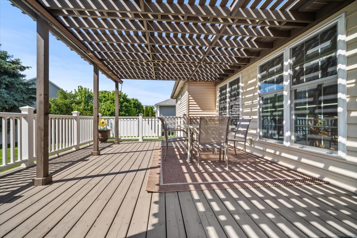 1721 Partridge Point Normal, IL 61761 - Photo 35 of 37 a patio with wooden floor a yard tables and chairs