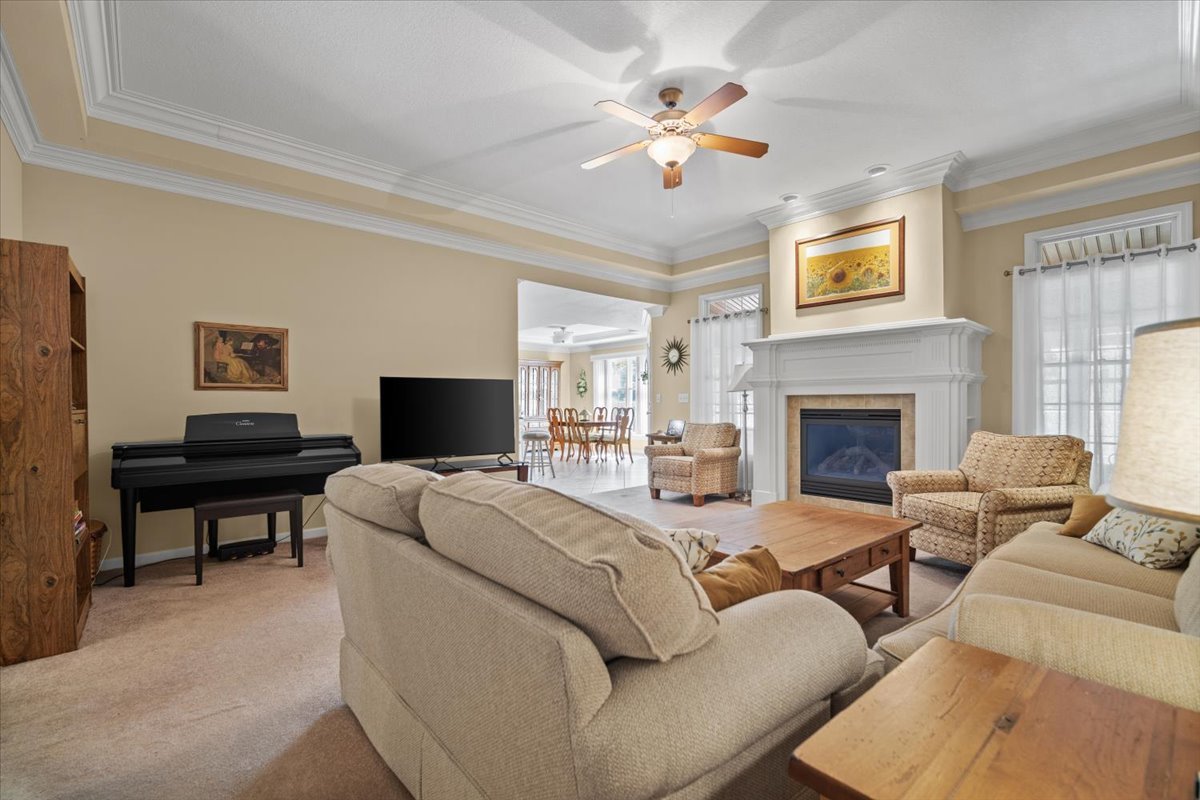 1721 Partridge Point Normal, IL 61761 - Photo 5 of 37 a living room with furniture a fireplace and a flat screen tv