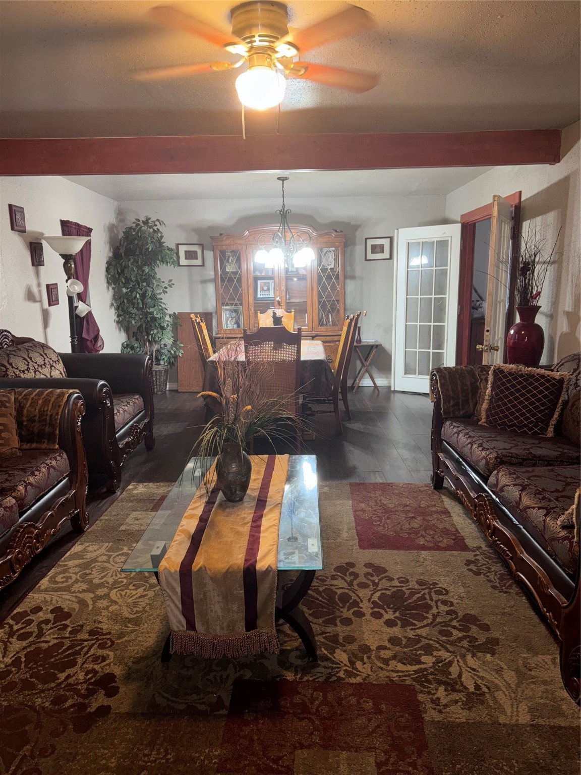 2519 Garapan Street Houston, TX 77091 - Photo 2 of 7 a living room with furniture a chandelier and a dining table
