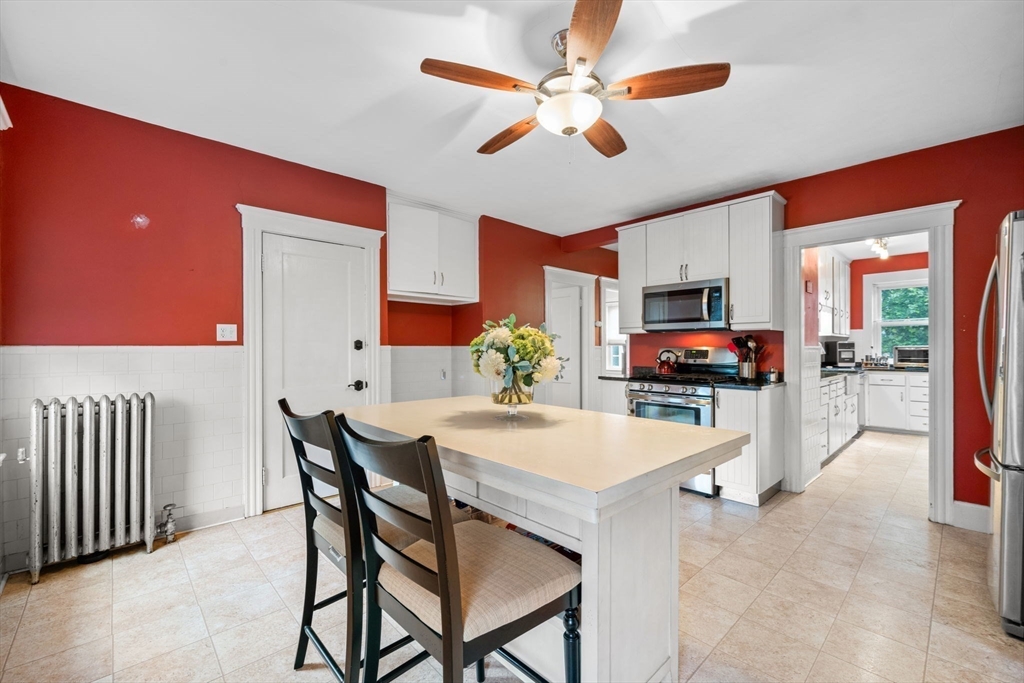 59 Leach Street, Unit 2 Salem, MA 01970 - Photo 11 of 38 a view of a dining room with furniture and a chandelier