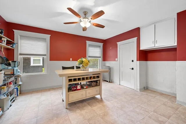 a view of kitchen with stainless steel appliances cabinets and a window