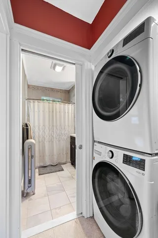 a view of a storage & utility room with dryer and washer