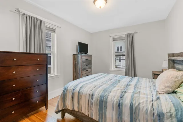 a bedroom with a bed and a dresser