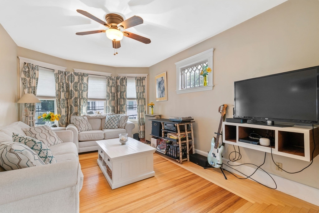 59 Leach Street, Unit 2 Salem, MA 01970 - Photo 9 of 38 a living room with furniture and a flat screen tv