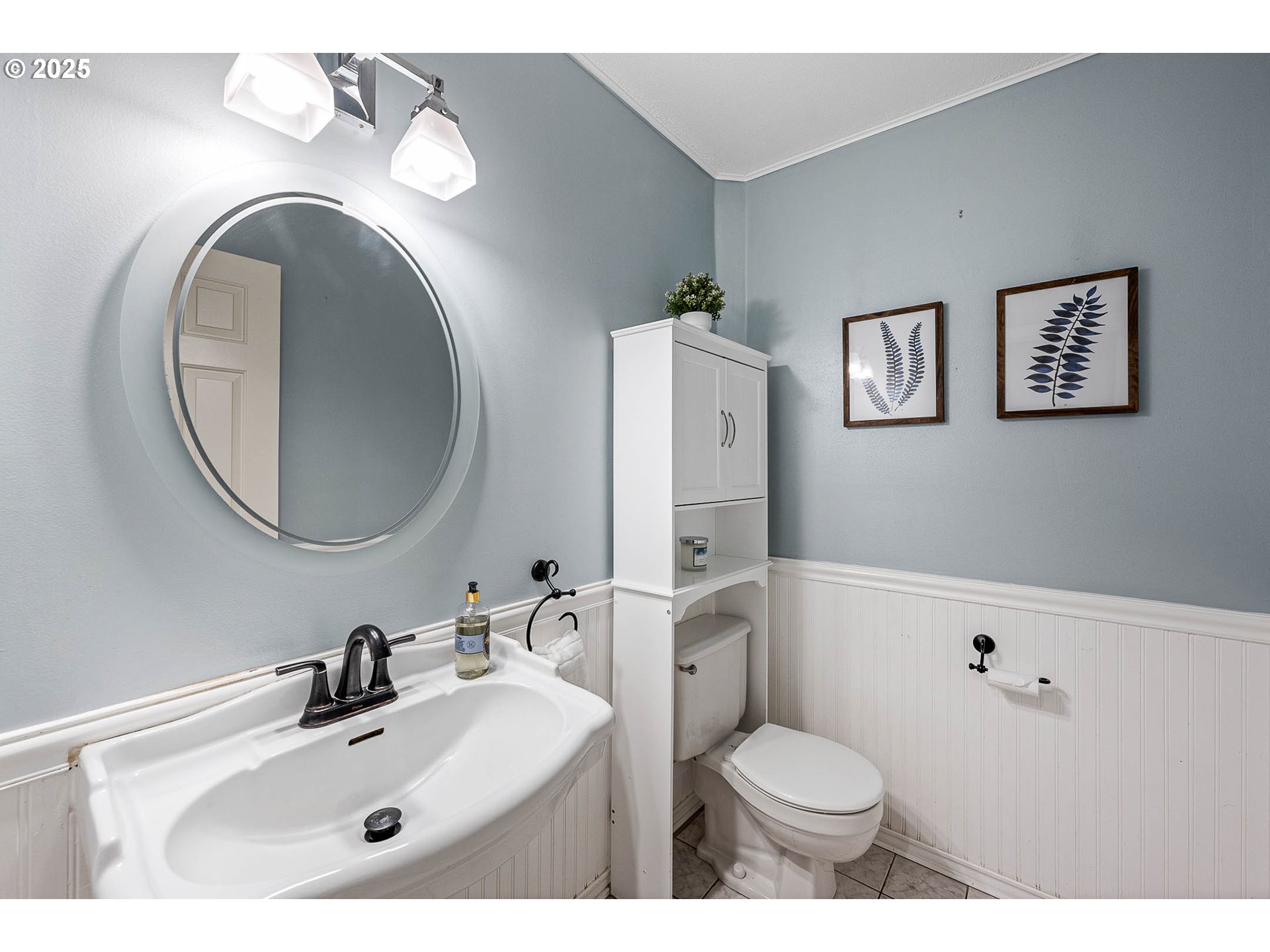 11450 Southwest Pintail Loop Beaverton, OR 97007 - Photo 14 of 35 a bathroom with a toilet sink vanity and mirror