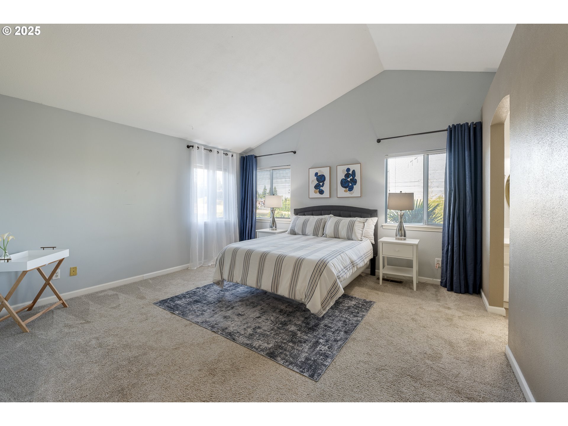 11450 Southwest Pintail Loop Beaverton, OR 97007 - Photo 17 of 35 a bedroom with a bed and a window