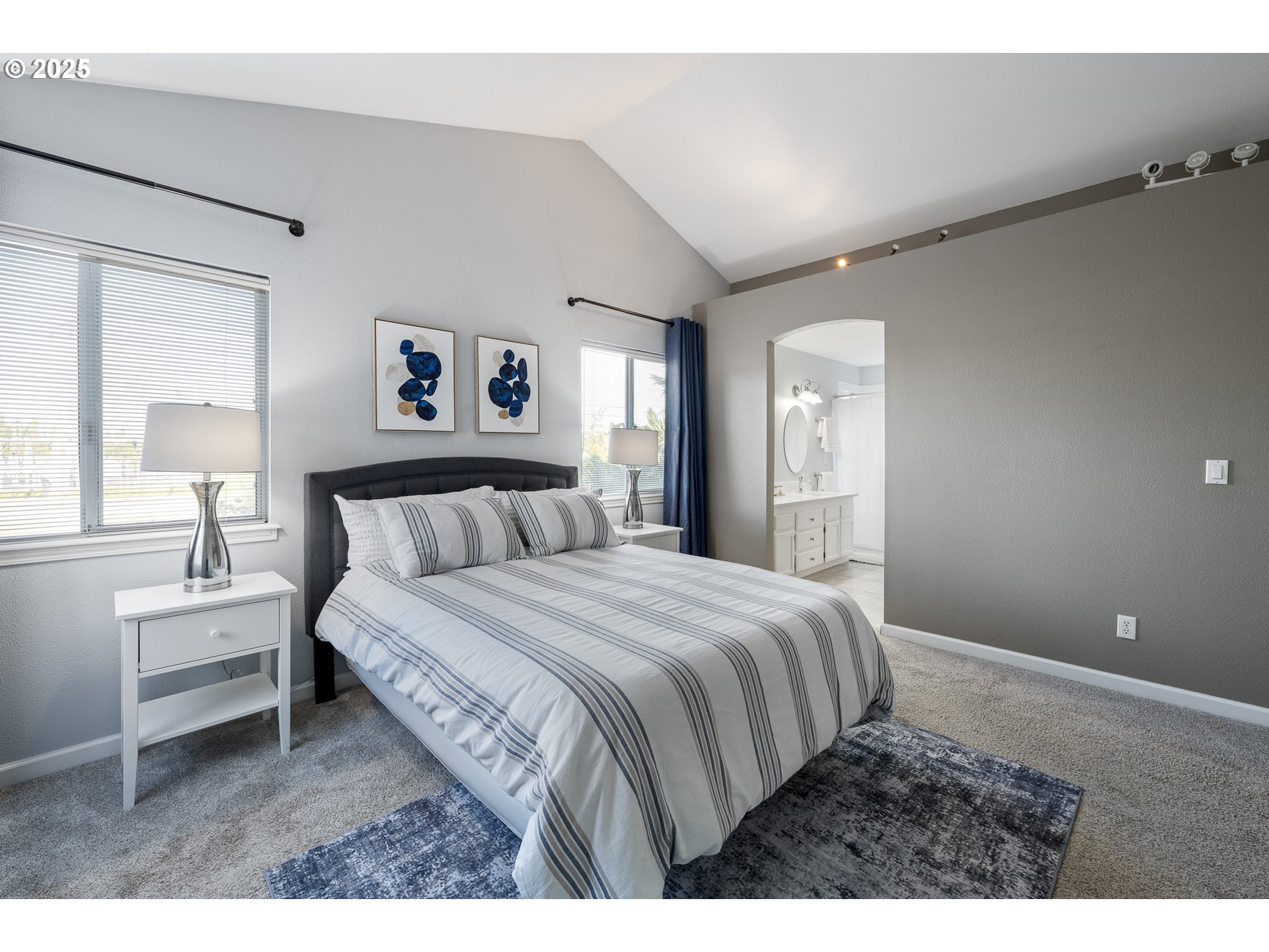 11450 Southwest Pintail Loop Beaverton, OR 97007 - Photo 18 of 35 a bedroom with a bed and a night stand