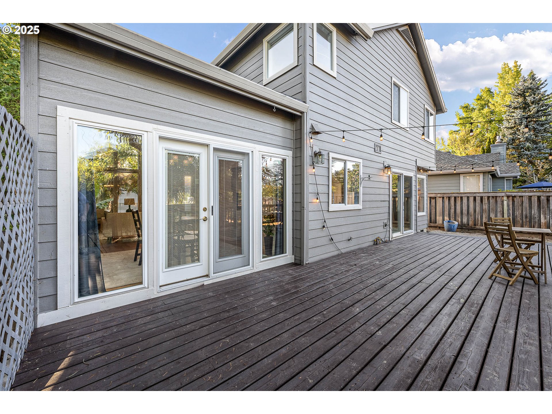 11450 Southwest Pintail Loop Beaverton, OR 97007 - Photo 30 of 35 a view of backyard with large trees and wooden floor