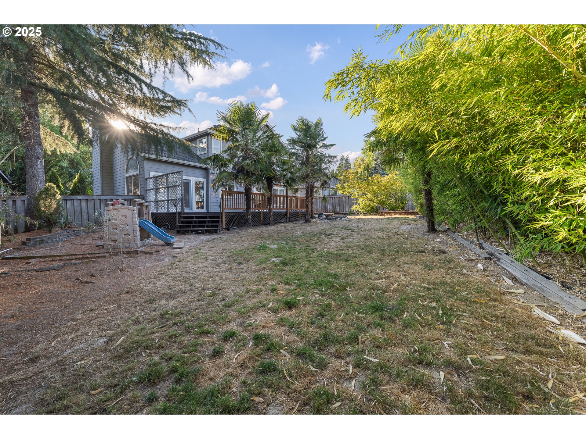 11450 Southwest Pintail Loop Beaverton, OR 97007 - Photo 32 of 35 a backyard of a house with lots of green space
