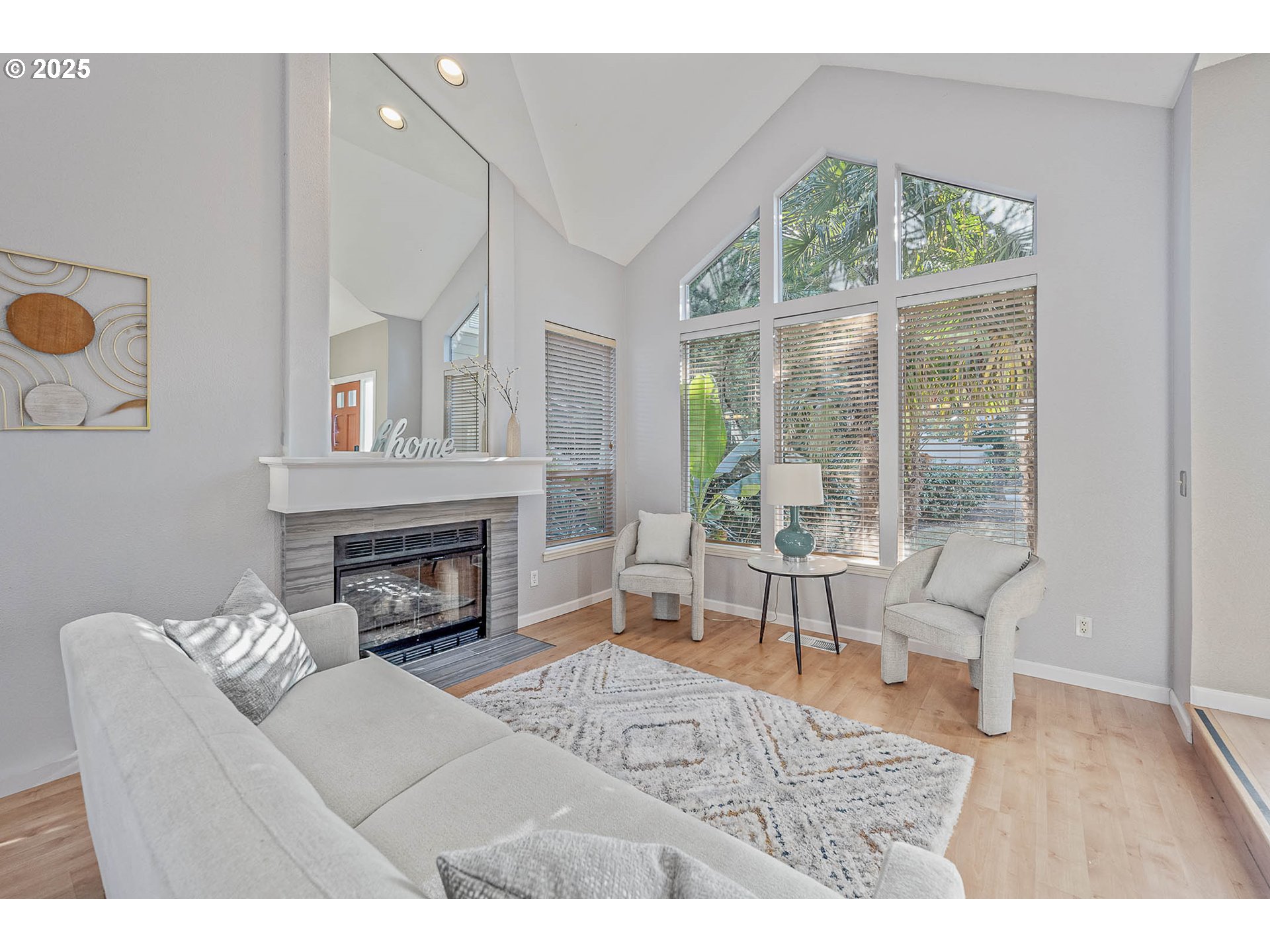 11450 Southwest Pintail Loop Beaverton, OR 97007 - Photo 4 of 35 a living room with furniture and a fireplace