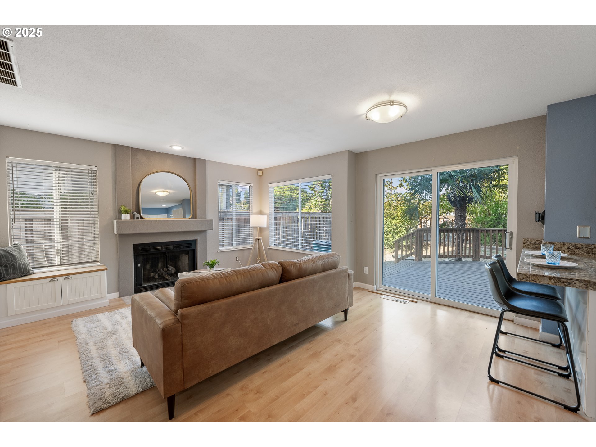 11450 Southwest Pintail Loop Beaverton, OR 97007 - Photo 8 of 35 a living room with furniture a fireplace and a table
