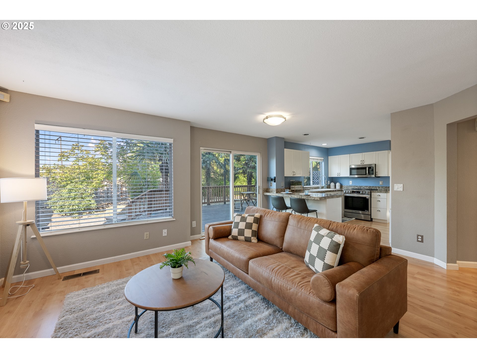 11450 Southwest Pintail Loop Beaverton, OR 97007 - Photo 9 of 35 a living room with furniture and a large window