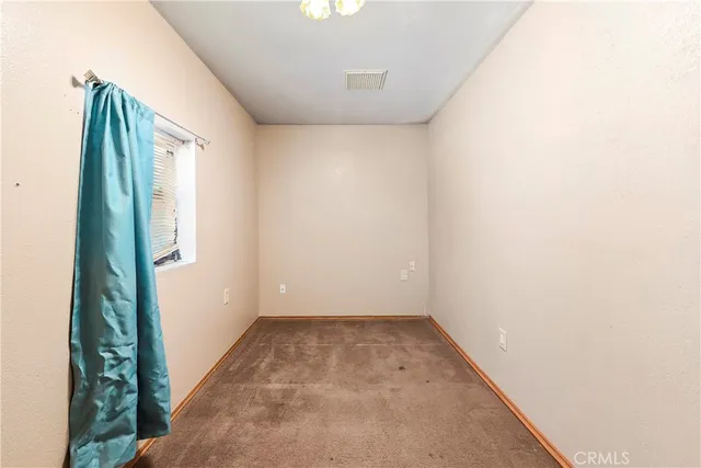 a kitchen with stainless steel appliances granite countertop a lot of cabinets and wooden floor