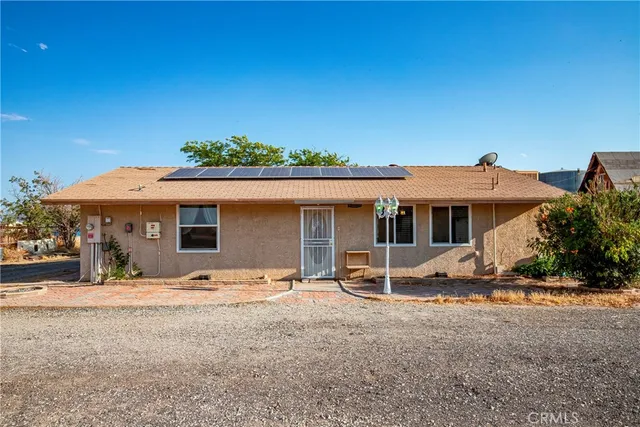 an empty room with closet and chandelier fan
