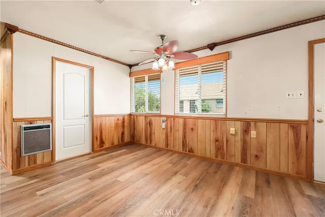 a view of an empty room with a fireplace