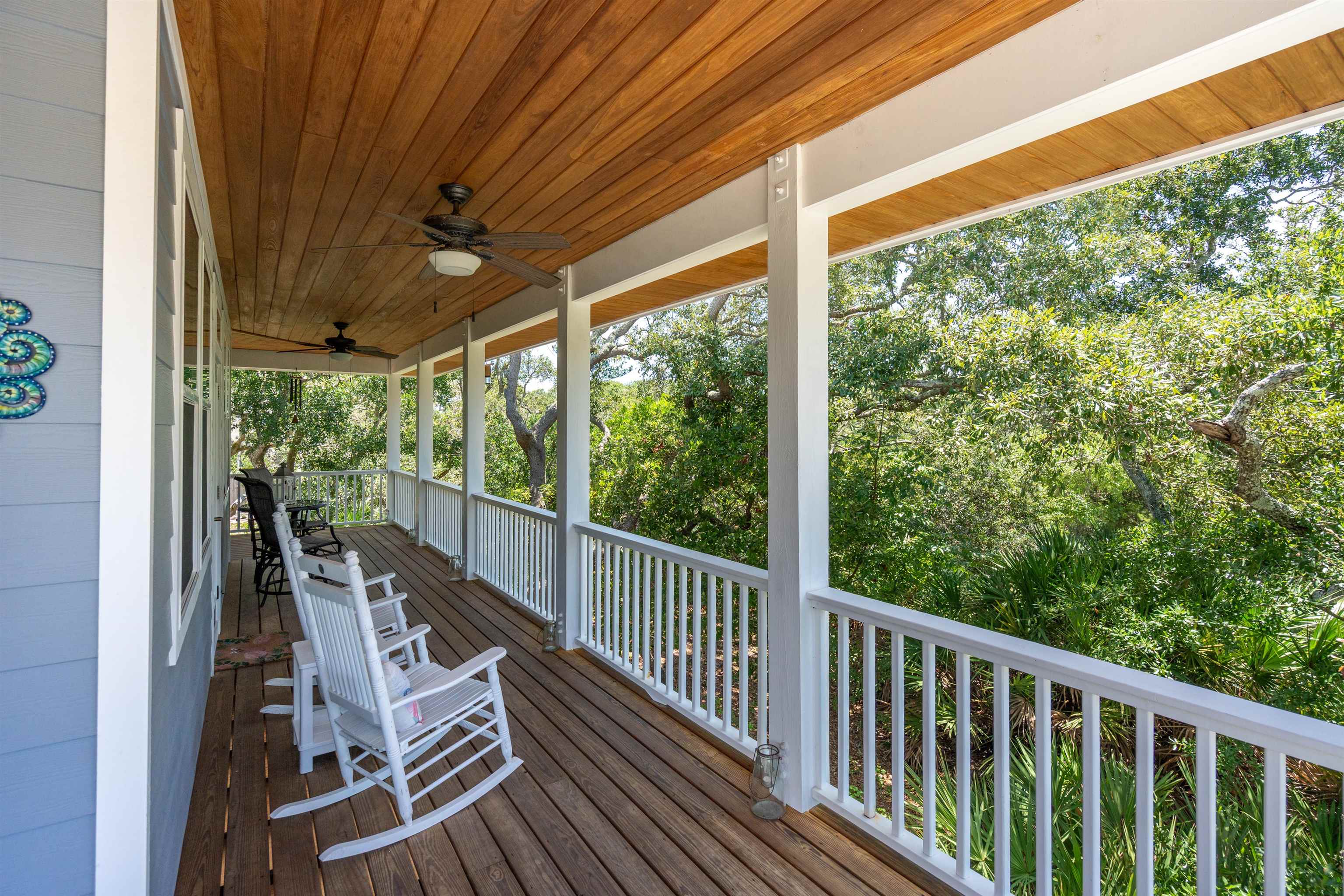 a view of balcony with wooden floor