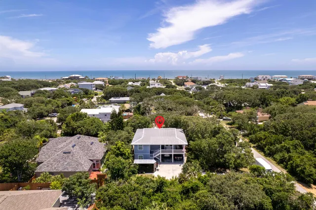 an aerial view of a house with a garden