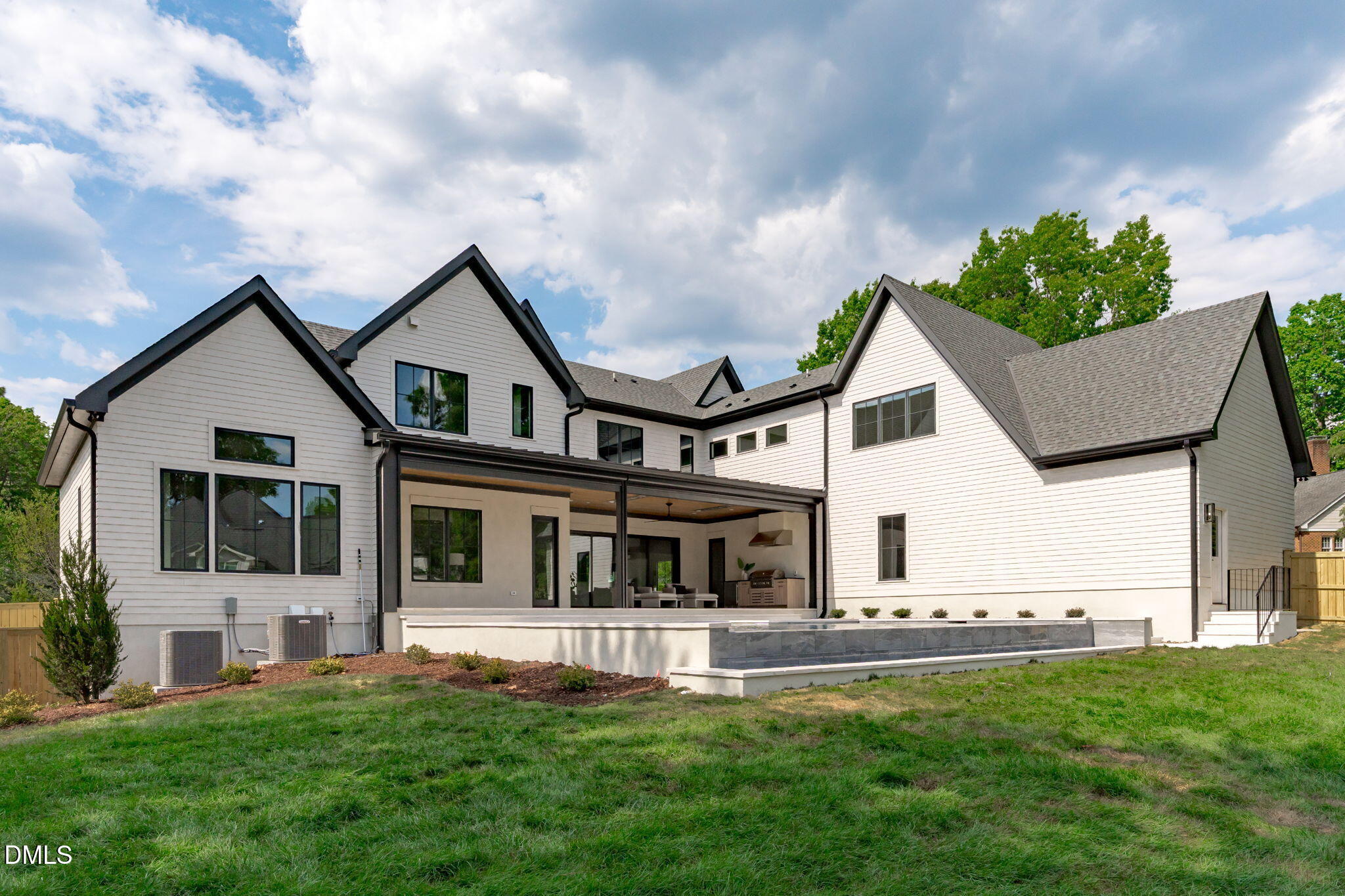 7917 South Bridgewater Court Raleigh, NC 27615 - Photo 65 of 67 a front view of a house with a garden and lake view