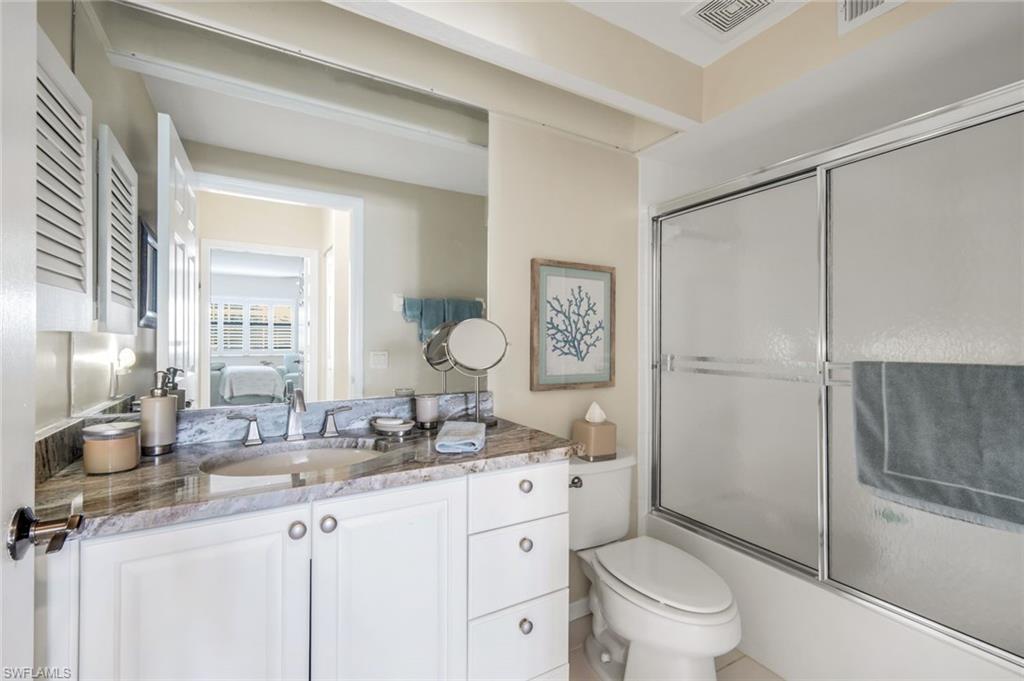 6879 Redbay Park Road, Unit 203 Naples, FL 34109 - Photo 25 of 43 Full bath featuring vanity, shower / bath combination with glass door, and ensuite bath