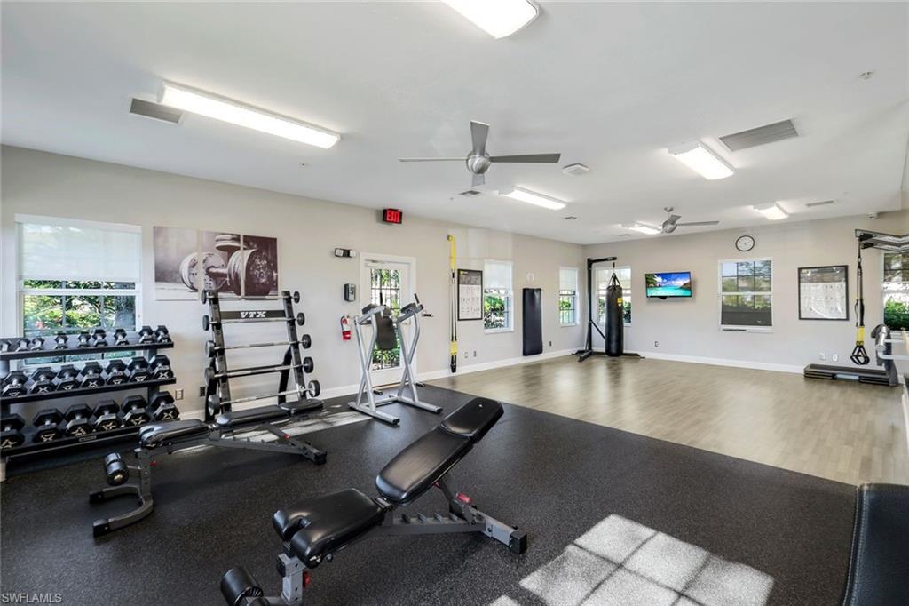 6879 Redbay Park Road, Unit 203 Naples, FL 34109 - Photo 37 of 43 Exercise room featuring a ceiling fan