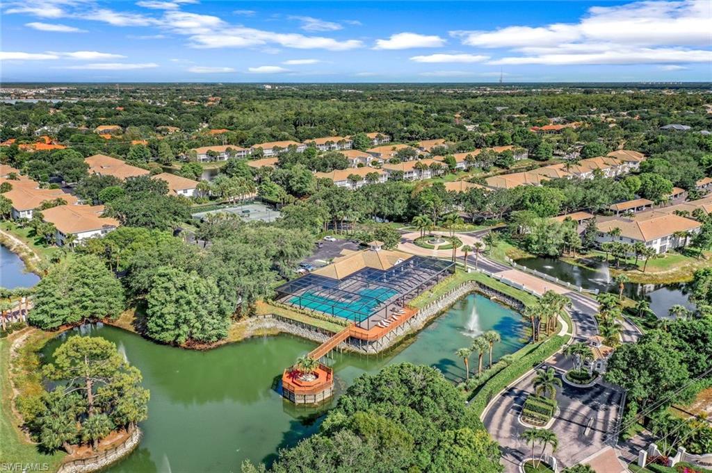 6879 Redbay Park Road, Unit 203 Naples, FL 34109 - Photo 38 of 43 Aerial perspective of suburban area with a large body of water