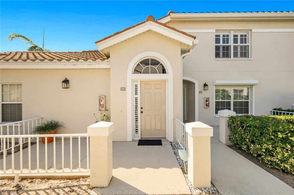 6879 Redbay Park Road, Unit 203 Naples, FL 34109 - Photo 4 of 43 Entrance to stairway to condo.
