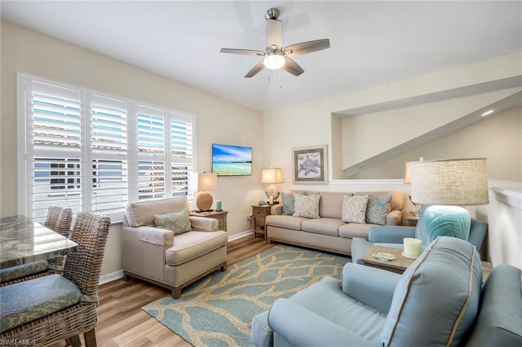 6879 Redbay Park Road, Unit 203 Naples, FL 34109 - Photo 7 of 43 Den - Wood floors and area rug