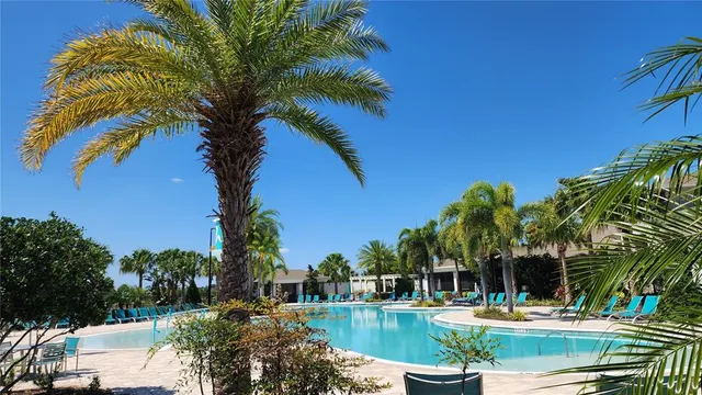 a view of a swimming pool with a table and chairs