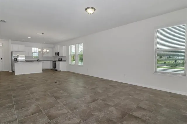 a view of a kitchen and a window