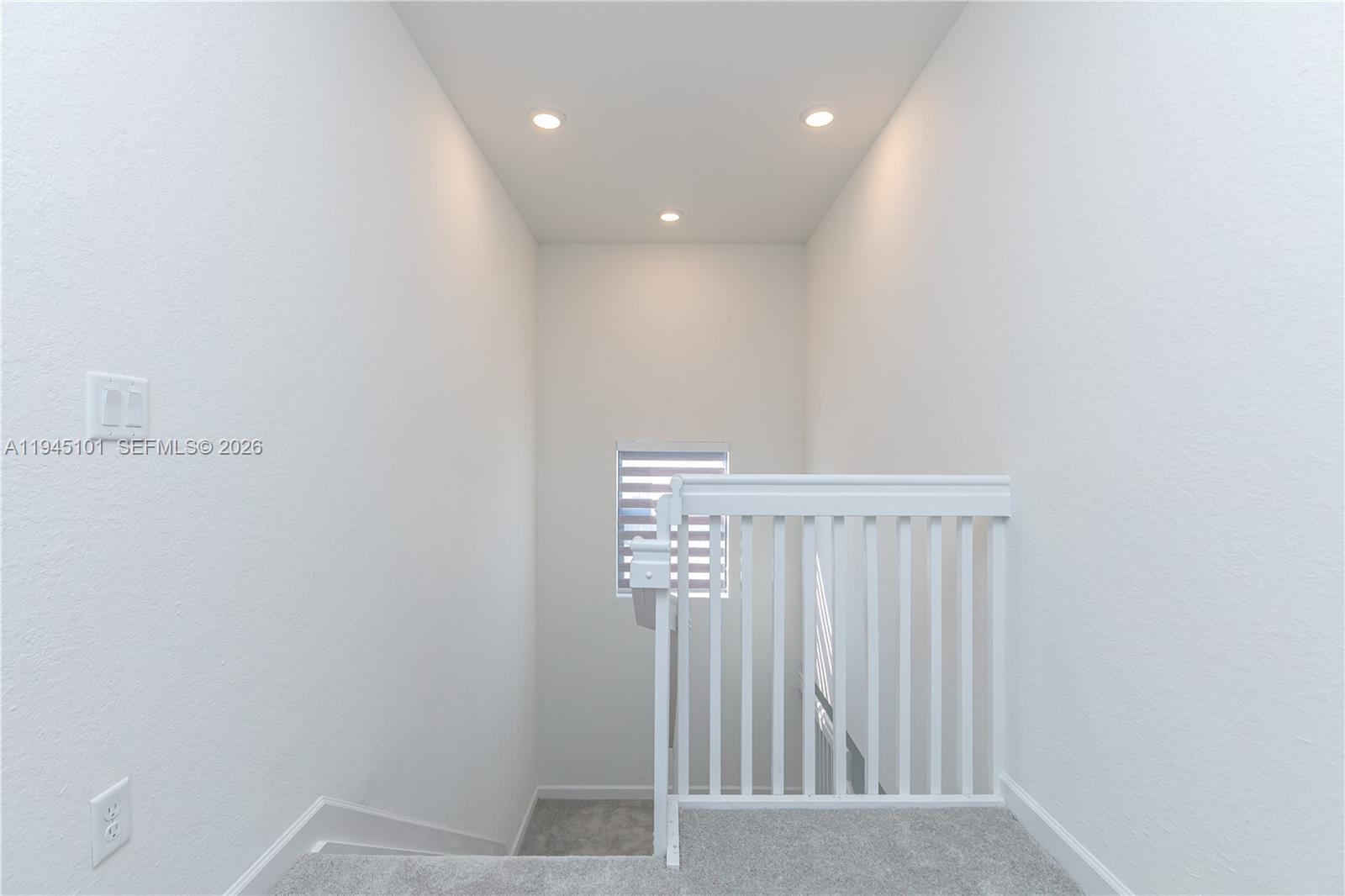 12990 Southwest 229th Lane Miami, FL 33170 - Photo 15 of 43 a view of staircase with white walls
