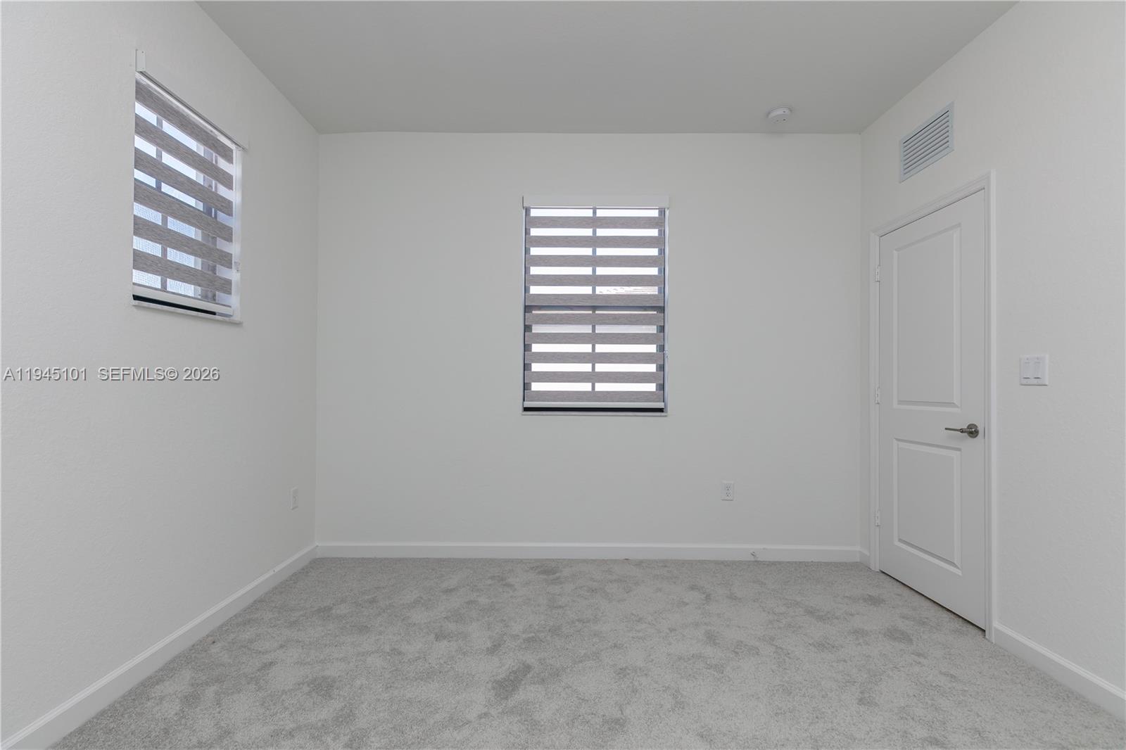 12990 Southwest 229th Lane Miami, FL 33170 - Photo 17 of 43 an empty room with windows