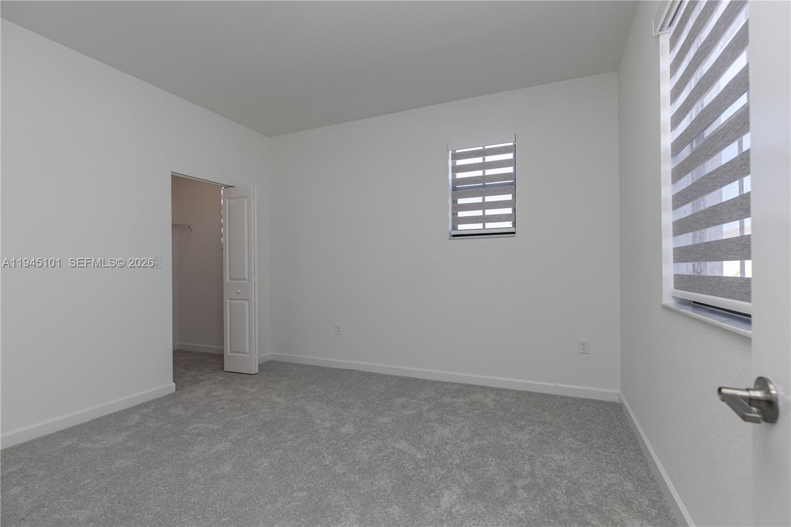 12990 Southwest 229th Lane Miami, FL 33170 - Photo 18 of 43 an empty room with windows
