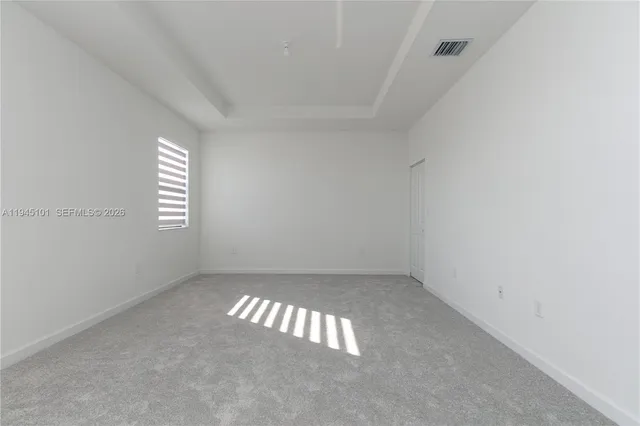 a view of an empty room with stairs