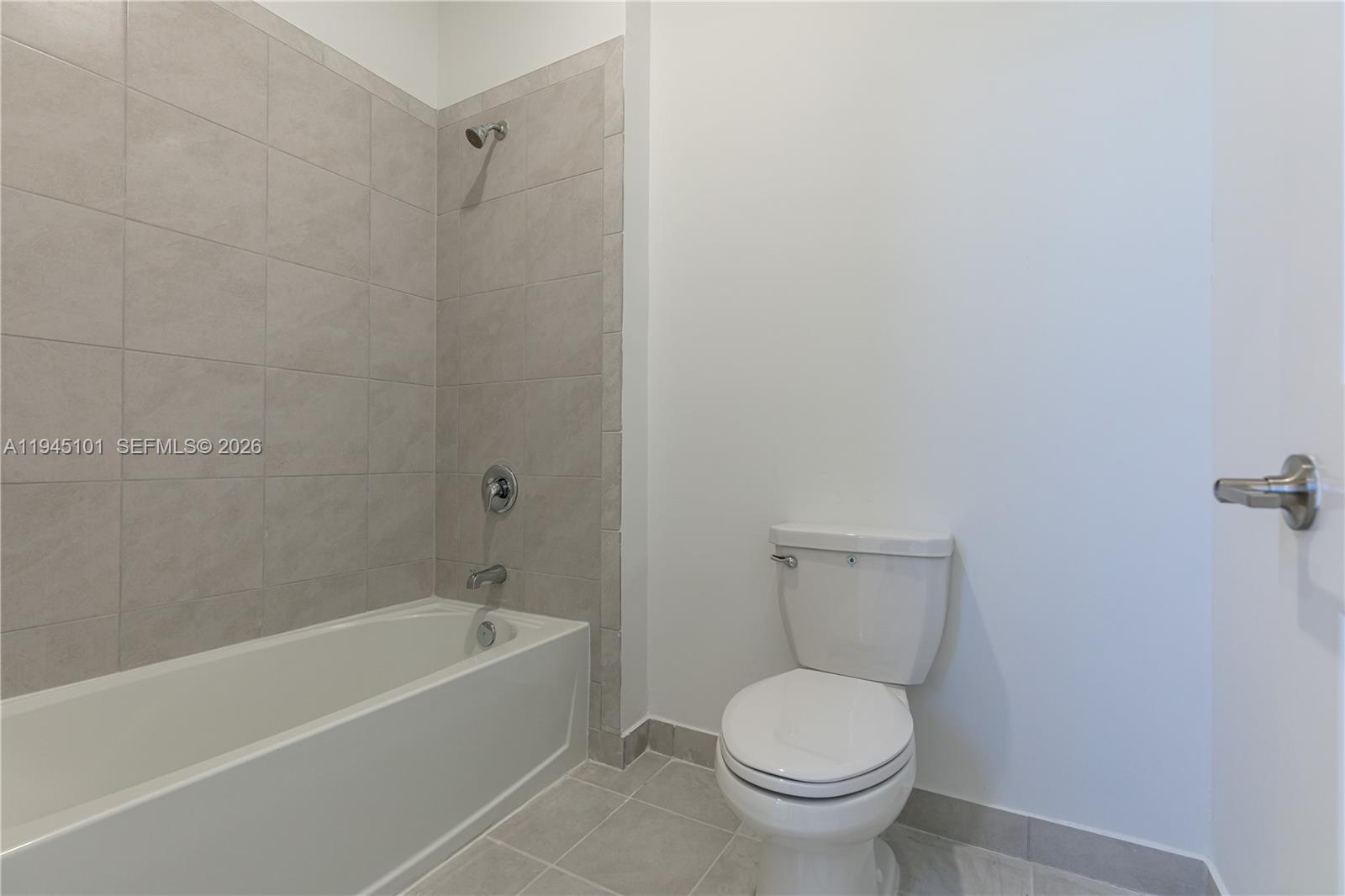 12990 Southwest 229th Lane Miami, FL 33170 - Photo 27 of 43 a white toilet sitting next to a bath tub