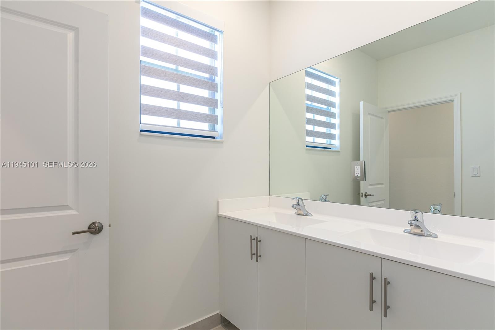 12990 Southwest 229th Lane Miami, FL 33170 - Photo 28 of 43 a bathroom with a sink and a mirror
