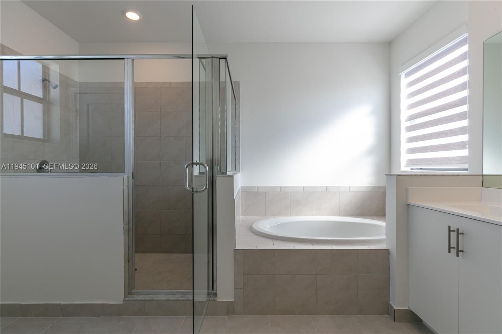 12990 Southwest 229th Lane Miami, FL 33170 - Photo 32 of 43 a bathroom with a shower and a bathtub