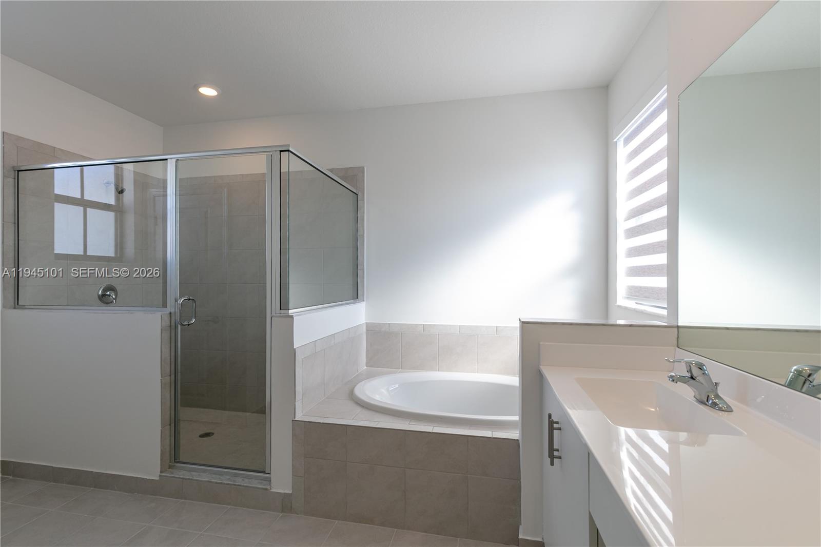 12990 Southwest 229th Lane Miami, FL 33170 - Photo 33 of 43 a bathroom with a tub sink and mirror