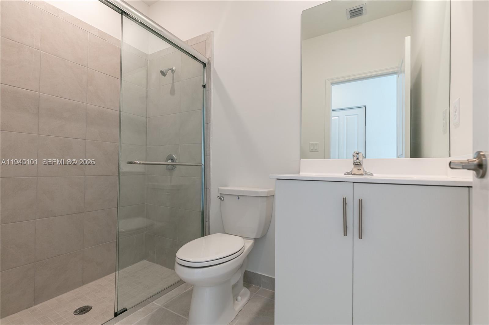 12990 Southwest 229th Lane Miami, FL 33170 - Photo 35 of 43 a bathroom with a shower a toilet and a sink