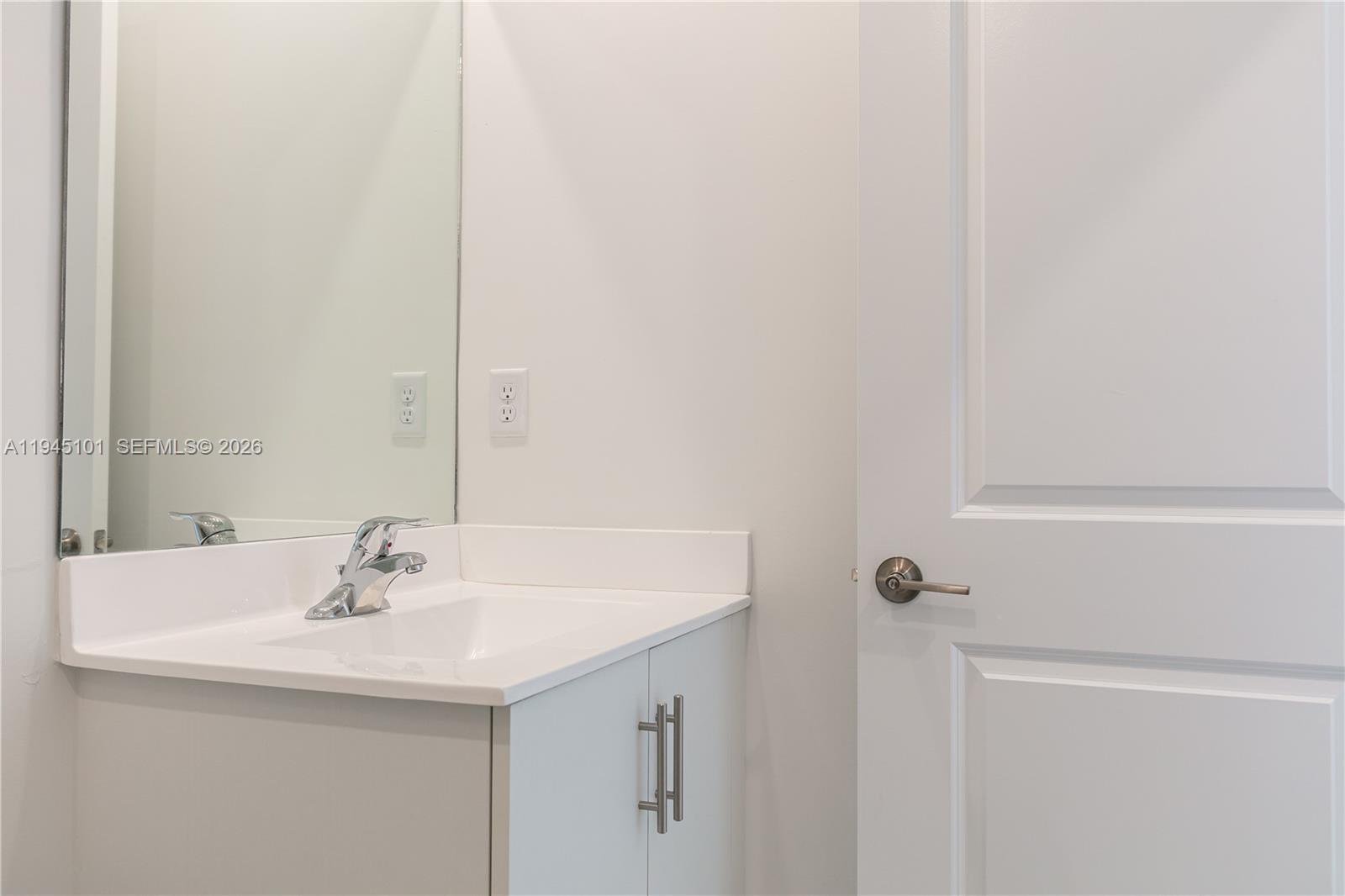 12990 Southwest 229th Lane Miami, FL 33170 - Photo 37 of 43 a bathroom with a sink and a mirror