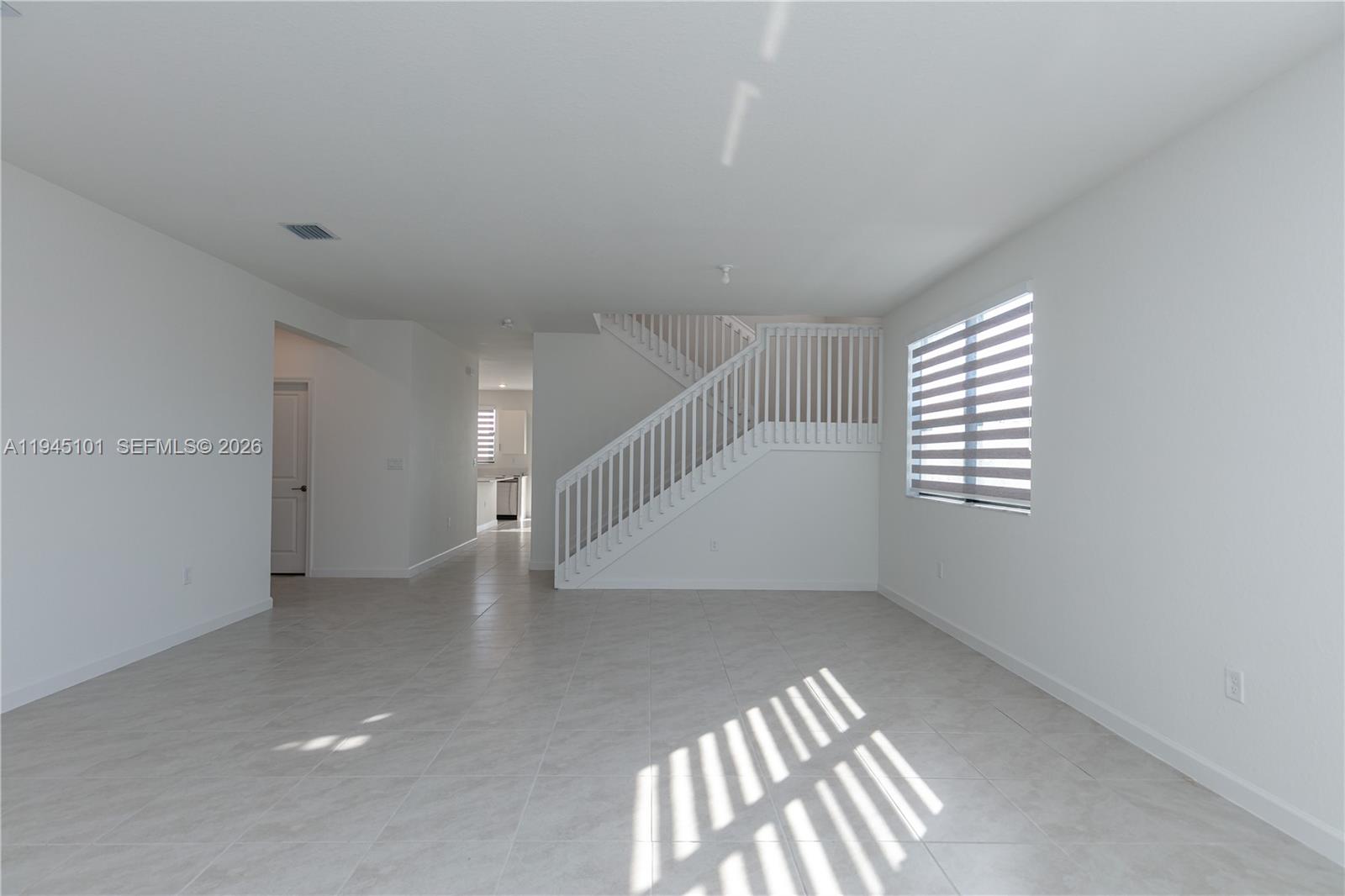 12990 Southwest 229th Lane Miami, FL 33170 - Photo 7 of 43 an empty room with windows