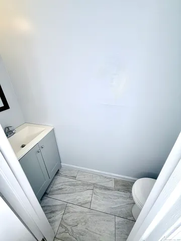 a bathroom with a sink and toilet