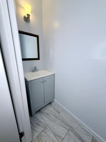 a view of a bathroom from a hallway