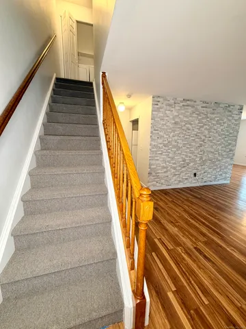 a view of staircase with wooden floor and staircase