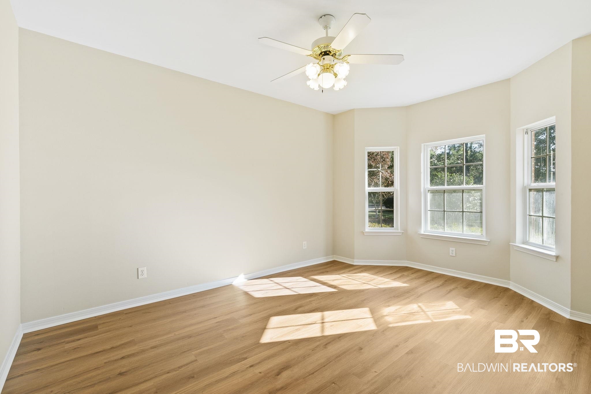 9631 Bay Meadows Avenue Fairhope, AL 36532 - Photo 24 of 49 Bedroom with ceiling fan and light hardwood / wood-style flooring, and bay window.