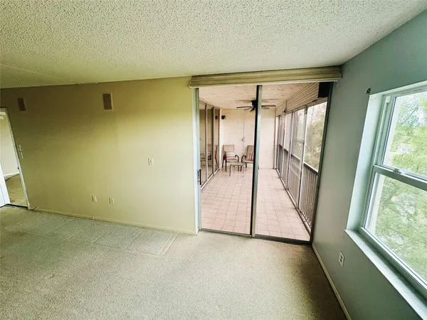 a bathroom with a sink vanity mirror and toilet