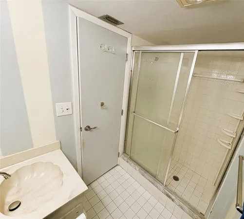 a bathroom with a tub and shower