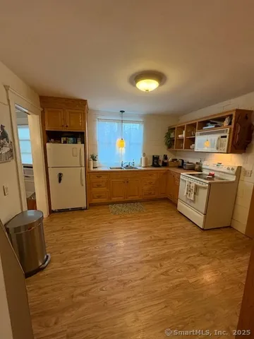 a kitchen with stainless steel appliances granite countertop a stove and a refrigerator
