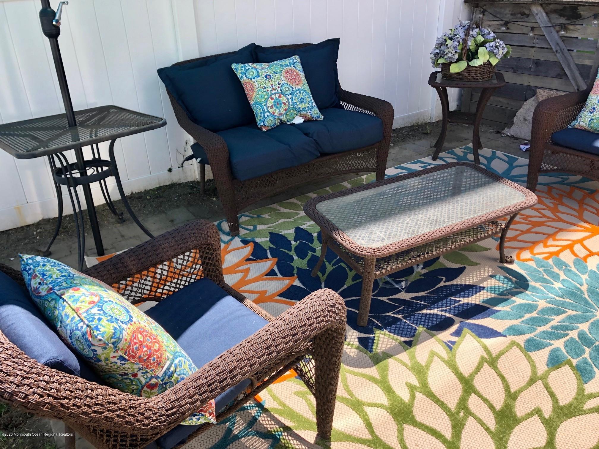 216 Main Street, Unit UP Avon-by-the-Sea, NJ 07717 - Photo 18 of 20 a living room with furniture