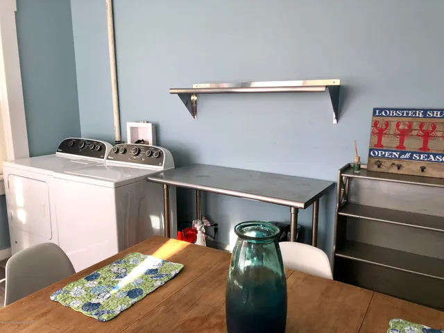 a living room with a couch and a stove